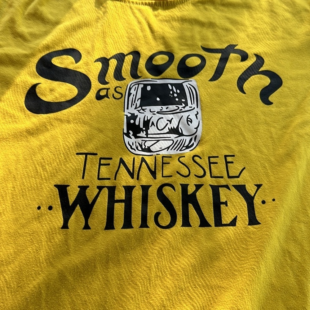 Size large men’s or women’s smooth is Tennessee whiskey, graphic mustard T-shirt